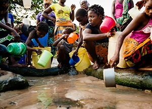 Women and children collecting unsanitary water