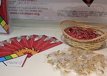 A cancer prevention leaflet and a rainbow ribbon badge