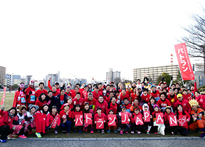 A group photo of Patrol Run members at a marathon