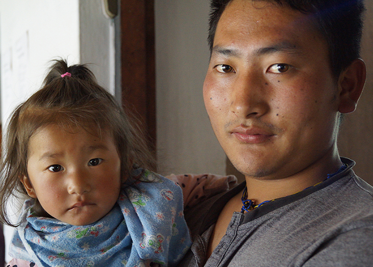 A father and his child waiting to see the doctor in Bhutan